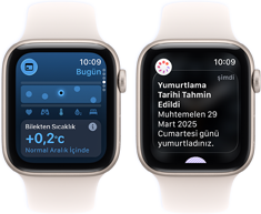 Yıldız Işığı renkte alüminyum kasaya sahip iki adet Apple Watch SE 3, ekranlarında Yaşam Bulguları uygulaması gösteriliyor