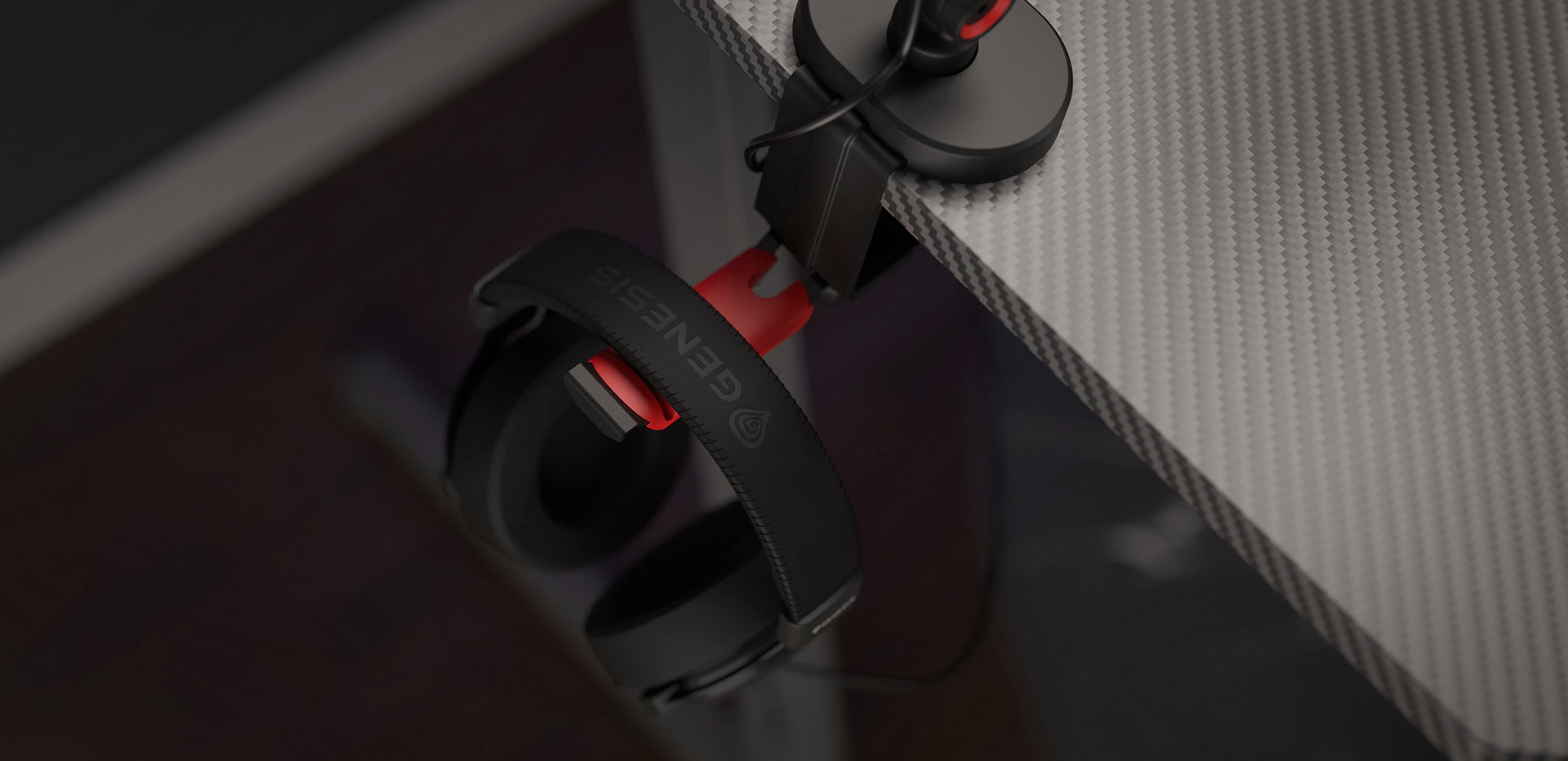 Microphone arm with a headset hanger, showing a headset with red accents attached to the edge of a desk