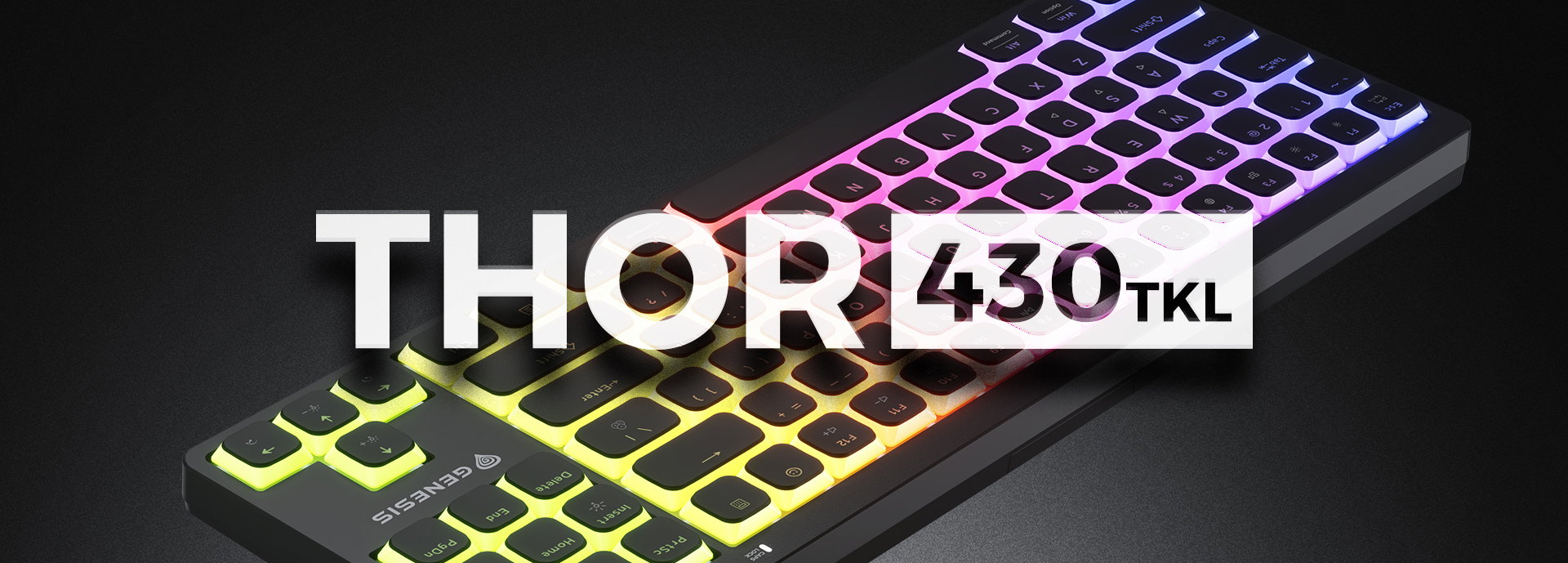 Keyboard with illuminated keys showcasing a gradient of colors on a dark surface.