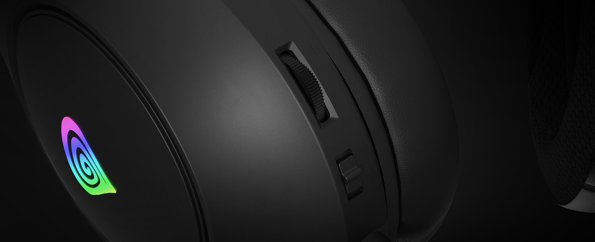 Black over-ear headphones with a colorful logo and a volume control dial