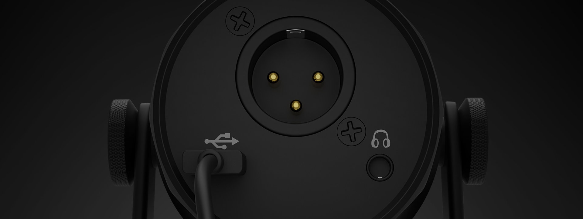 Back view of a microphone with audio output, USB input, and headphone jack