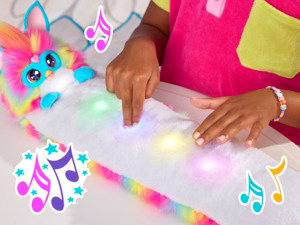 Colorful musical notes and hands interacting with what appears to be an illuminated surface or display with pink and blue lighting effects.
