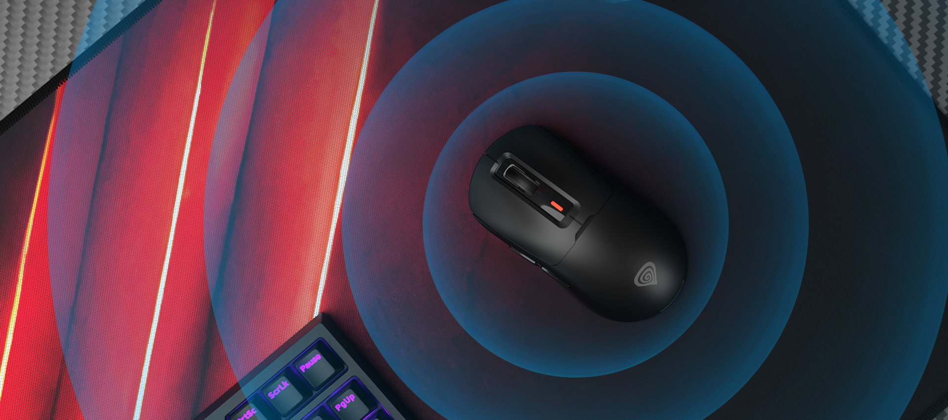Wireless gaming mouse Genesis Zircon 660 Pro in black, placed on a colorful illuminated mouse pad with a keyboard nearby